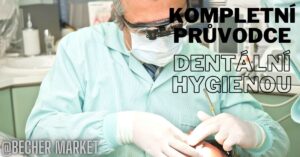 a dentist in protective gear performing dental hygiene procedures using dental tools on a patient’s teeth