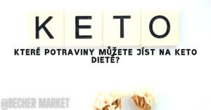 wooden block letters spelling "KETO" with a question in Czech about keto-friendly foods for a ketogenic diet, featuring dried flowers below.