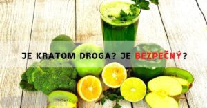 a green smoothie made from fresh ingredients like lime, lemon, orange, broccoli, and cilantro on a wooden surface
