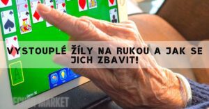 an elderly person touching a digital screen displaying an Uno card game with visible veins on their hand.