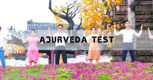 four people performing a traditional Ayurvedic dóša test pose outdoors with raised hands, surrounded by blooming flowers and a tree in full bloom.
