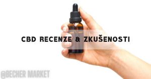 a hand holding a small amber CBD oil dropper bottle against a plain background, highlighting potential "zkušenosti s cbd" for health concerns.