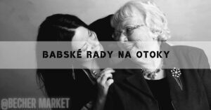 two women sharing a close, intimate conversation, one appearing to gently touch the other’s face, set against a neutral background.