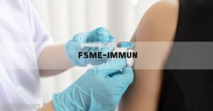 a medical professional administering an FSME-IMMUN 0,5 ml vaccine injection into an upper arm.
