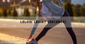a woman stretching to tie her sporty shoe during an outdoor workout, wearing fitted leggings and a casual top.