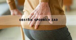 a person holding their lower back in pain, demonstrating lower back discomfort or obstruction.